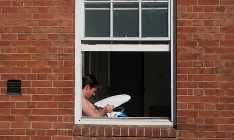 A man using a homemade sun reflector in London.