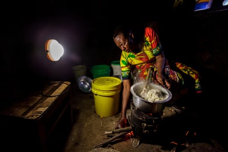 A woman prepares food on a cookstove at her home near Arusha, Tanzania.