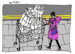 A woman with a shopping trolley full of toilet rolls