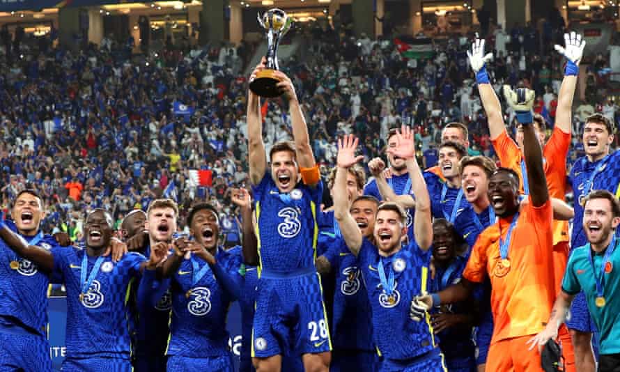 César Azpilicueta lifts the trophy as his teammates celebrate winning the Club World Cup final