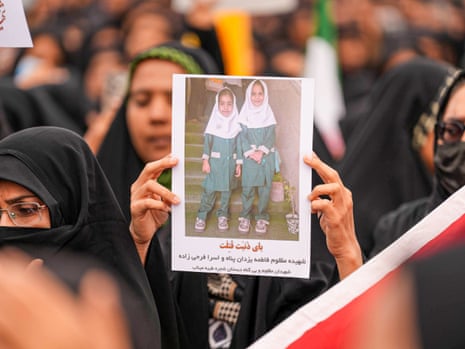 Mourners hold a portrait of students during a funeral ceremony for children, who lost their lives after a primary school in Iranâs Hormozgan province was targeted in US and Israeli attacks, on March 03, 2026 in Minab, Iran.