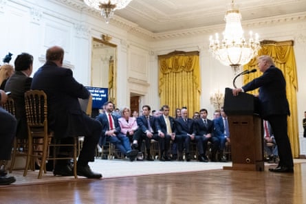 Trump addressing the nation as senior members of his administration look on