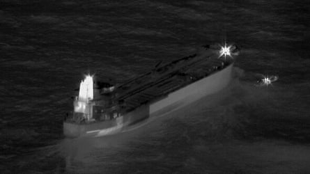 A tanker at sea in the dark