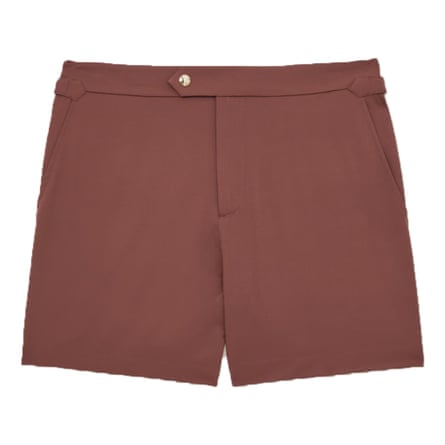 A pair of terracotta brown swim shorts