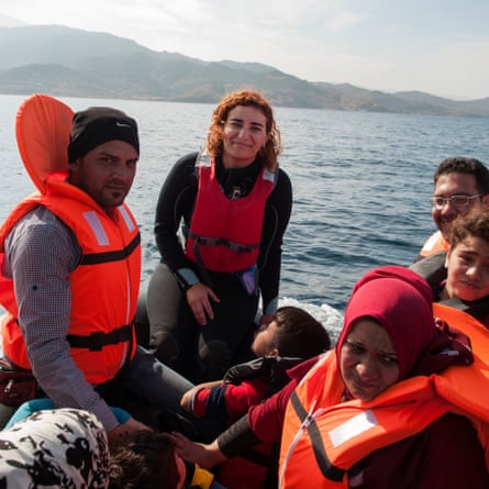 Photojournalist Güliz Karaoğlan Vural, centre, crossed with the refugees from Sivrice Bay in Turkey to the Greek island of Lesbos.