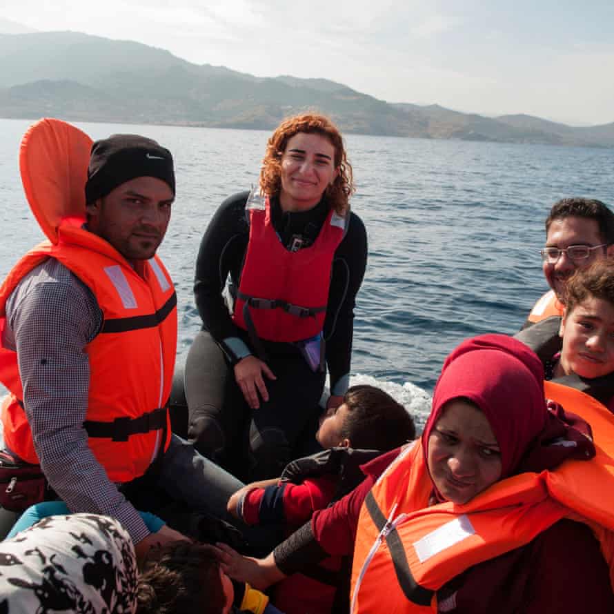 Photojournalist GÃ¼liz KaraoÄŸlan Vural, center, crossed paths with refugees from Sivrice Bay in Turkey to the Greek island of Lesbos.