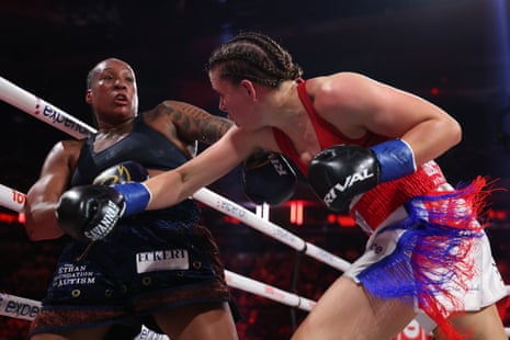 Shadasia Green, left, takes a punch from Savannah Marshall during their title unification bout on Friday night in New York.
