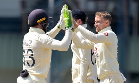 Joe Root celebrates with Jos Buttler after taking the wicket of Lasith Embuldeniya.