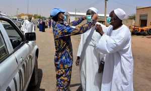 Bangladeshi UN peacekeepers provide masks and hand sanitizers to people in El Fasher, North Darfur.