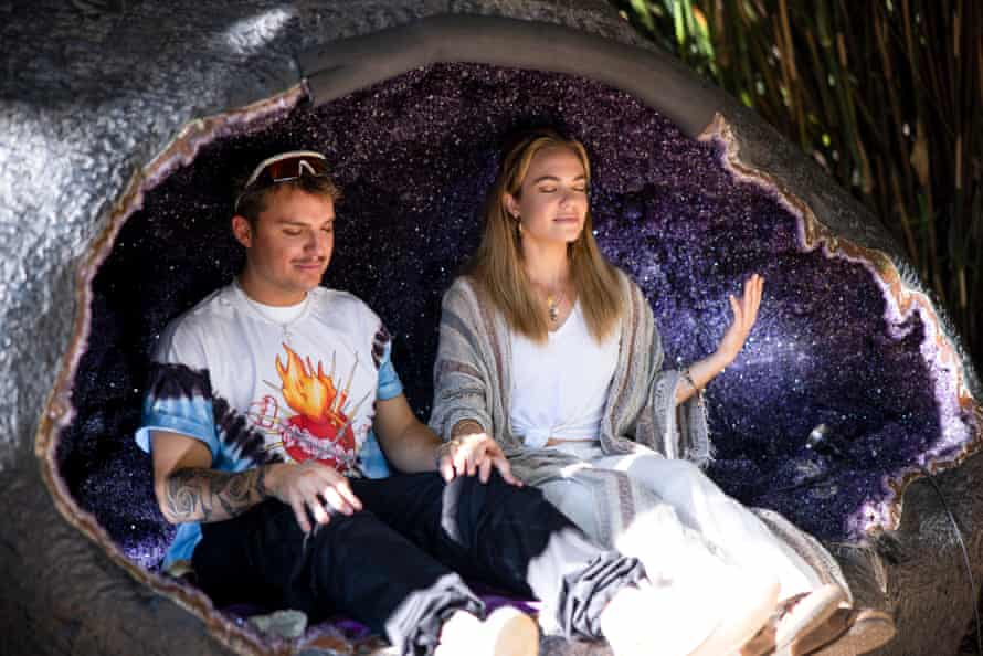 Jade and Hannah sit in a giant crystal geode discussing dragon bones.