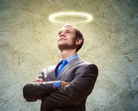 A man in a smart suit, arms crossed, with a halo above his head