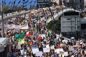 Climate change protestors are seen crossing the Victoria Bridge during the Global Strike 4 Climate rally in Brisbane.