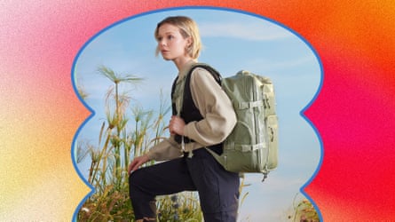 Woman moderls the Calpak Terra 26L laptop duffel backpack