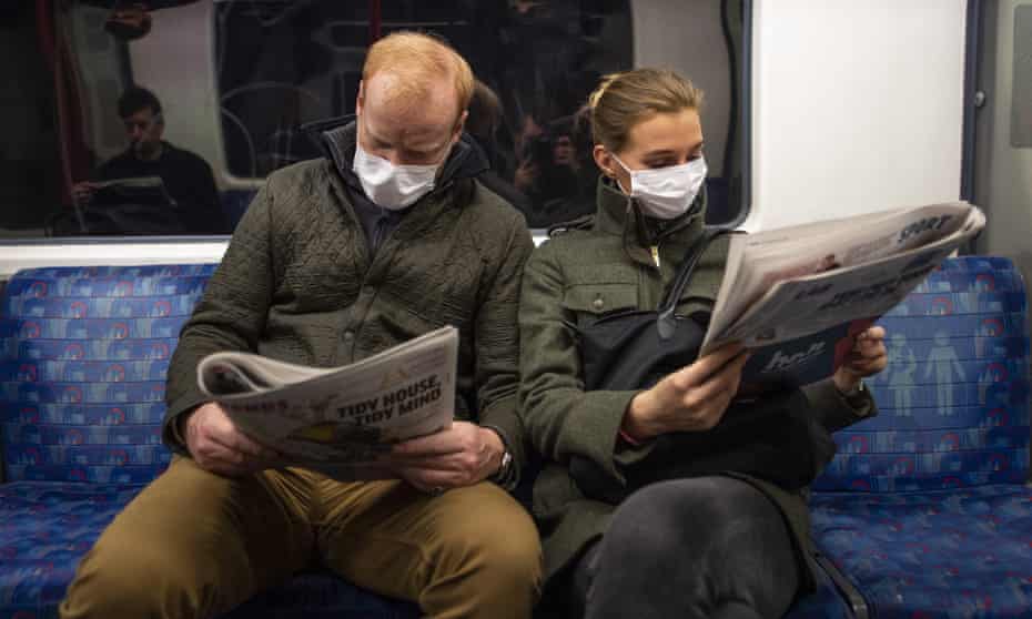 A couple on the London Underground in March 2020.