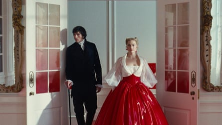 Jacob Elordi in black morning suite as Heathcliff and Margot Robbie as Catherine in red vinyl ball gown with white top