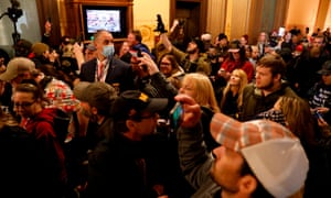 Protesters at the Michigan state capitol in Lansing on 30 April.