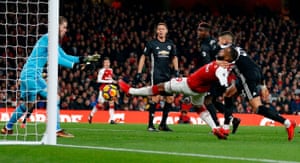 Manchester United’s Spanish goalkeeper David de Gea (L) reacts to Arsenal’s French striker Alexandre Lacazette during United’s 3 v 1 victory.David de Gea made 14 saves in the game, the joint-most in a Premier League game since 2003-04.