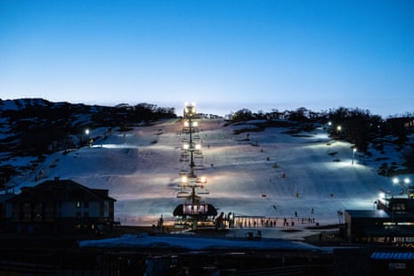 People ski on man-made snow at Perisher Blue Ski Resort in NSW.