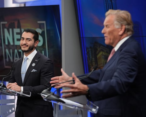 Republican nominee for Senate Mike Rogers, right, speaks during a televised debate with Democratic nominee for Senate Abdul El-Sayed in Michigan on 8 Ocotber.