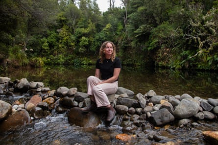 ‘Welcome to my heaven’: Kate Selby Smith sits beside a swimming hole at the southern end of Coromandel forest park.