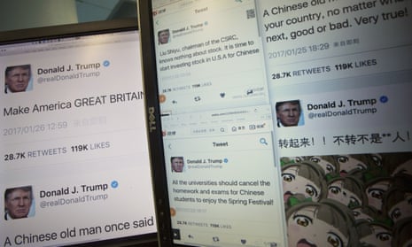 Computer screens display fake tweets that users can generate at a Chinese website.