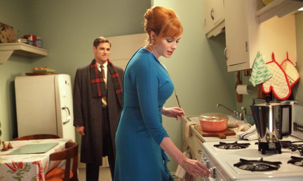 Christina Hendricks as Joan Holloway and Sam Page as Greg Harris in kitchen in an episode of Mad Men