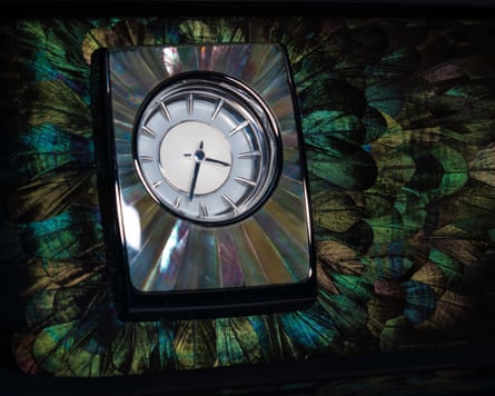 Detail of a Rolls-Royce phantom dashboard covered in iridescent feathers.