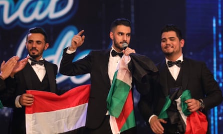 Arab Idol winner Yaqoub Shaheen, centre, with Yemeni contestant Ammar Mohammed (left) and fellow Palestinian Amir Dandan on stage during the final on Saturday.