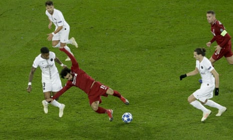 Paris Saint-Germain’s Presnel Kimpembe fouls Liverpool’s Mohamed Salah.