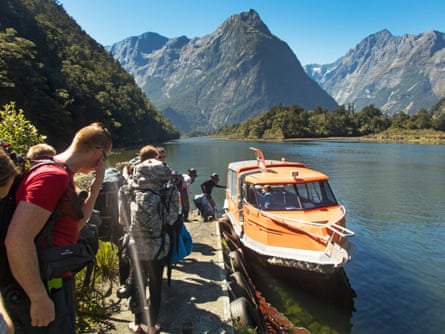 After reaching the end of the walk, a boat takes walkers out of Milford Sound.