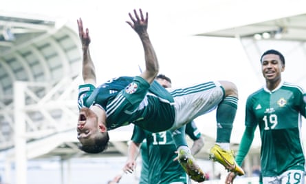 Paul Smyth does a backflip after scoring for Northern Ireland.