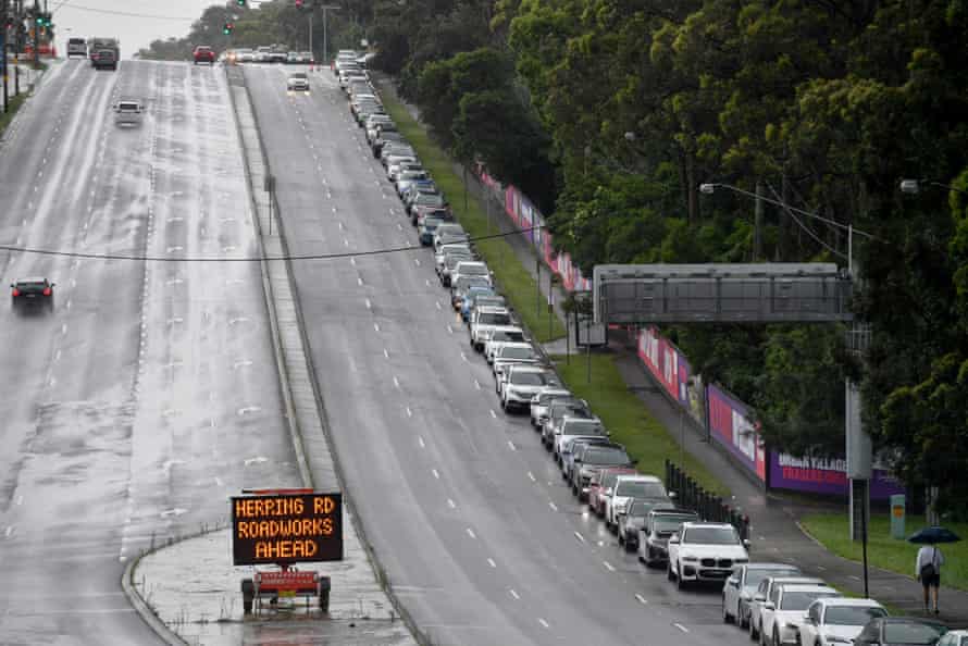 Cars queue for Covid testing at a clinic at North Ryde, Sydney