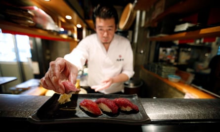 A sushi chef makes a meat sushi plate at Nikuzushi (meat sushi) restaurant in Tokyo.