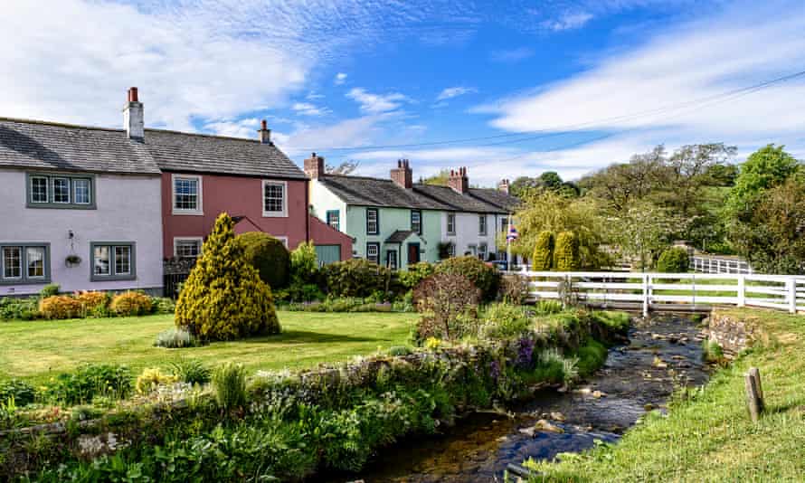 Quaint coloured houses by the beck in Caldbeck