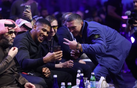 The former heavyweight champion Anthony Joshua, left, takes a selfie with Oleksandr Usyk, the division’s current king.