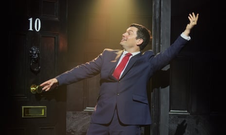 Charlie Baker as Blair makes a grand gesture at the door of No 10 in Tony! (The Tony Blair Rock Opera)