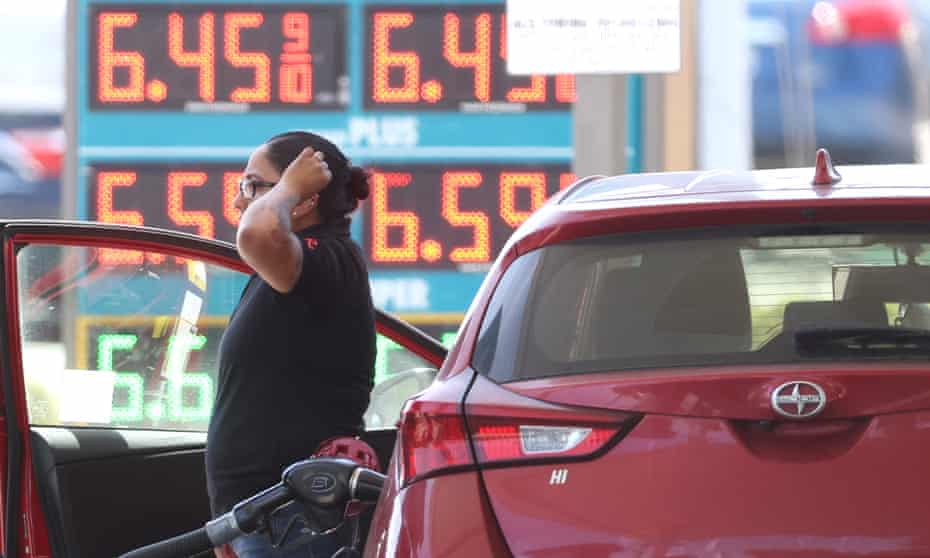 A customer pumps gas into their car at a gas station on in Petaluma, California.