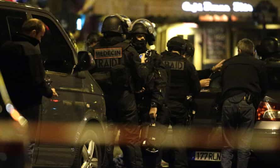 Police officers secure the area around the Bataclan theatre