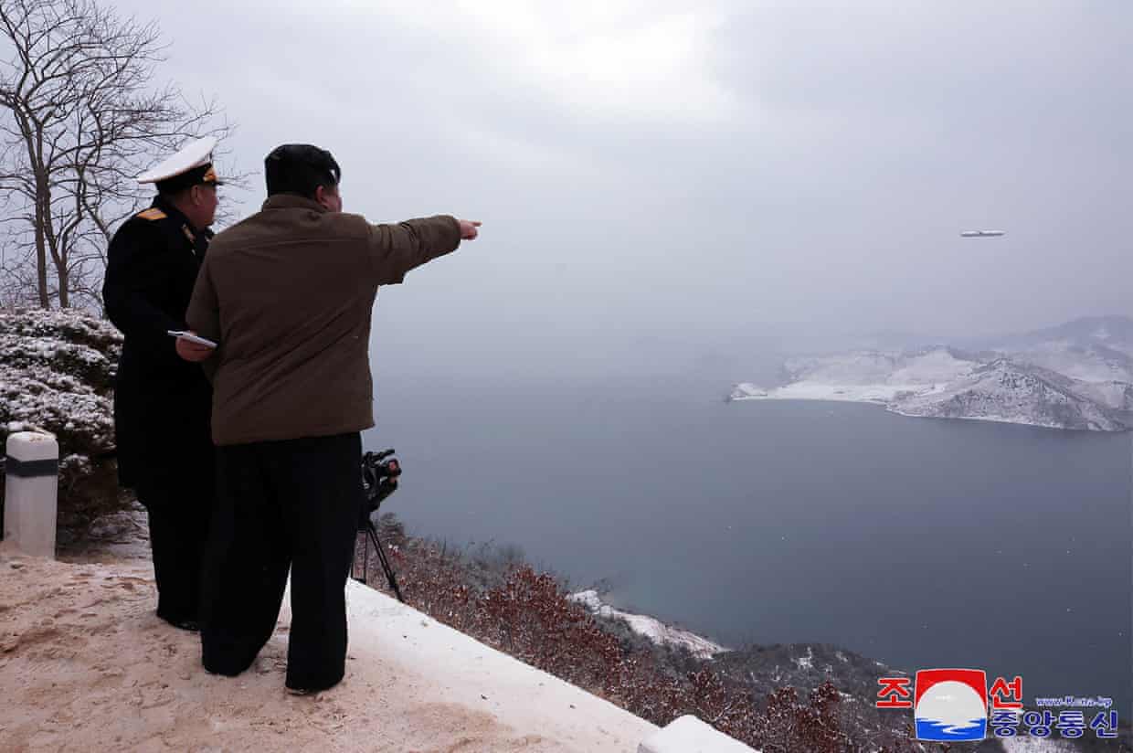 North Korean leader Kim Jong-un inspects the test-fire of a submarine-launched strategic cruise missile in North Korea in an image released by state media on Monday. Photograph: KCNA VIA KNS/AFP/Getty Images