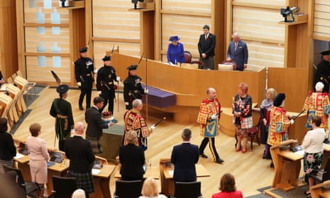 The Queen and the Duke of Rothesay watch as The Duke of Hamilton carries the Crown of Scotland into the Scottish Parliament in Edinburgh during a ceremony marking the 20th anniversary of devolution in the Holyrood chamber