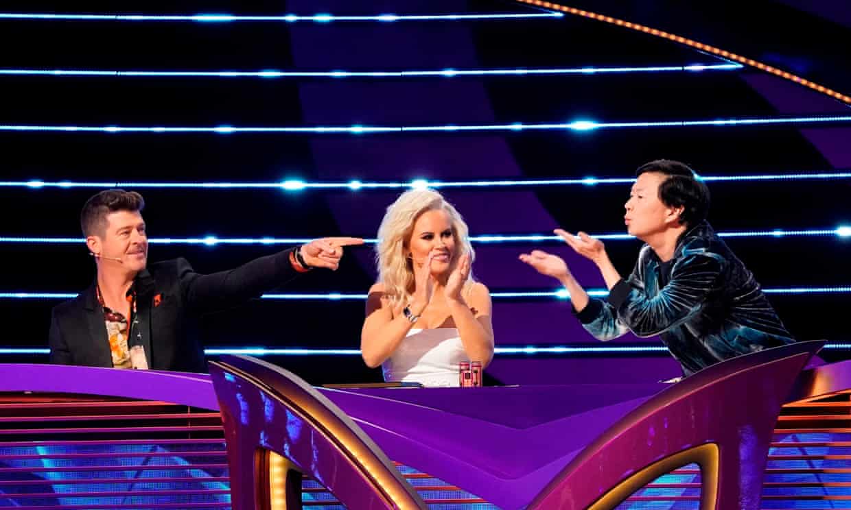 Robin Thicke and Ken Jeong with Jenny McCarthy on The Masked Singer.