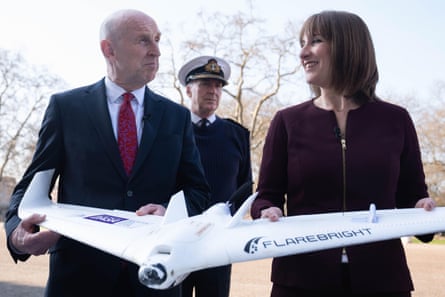 John Healey and Rachel Reeves hold a model plane.