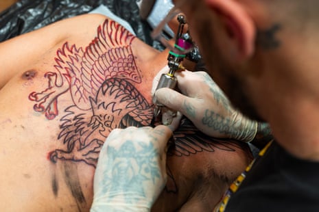 The first lines of the eagle’s wings are applied to Will’s debut tattoo