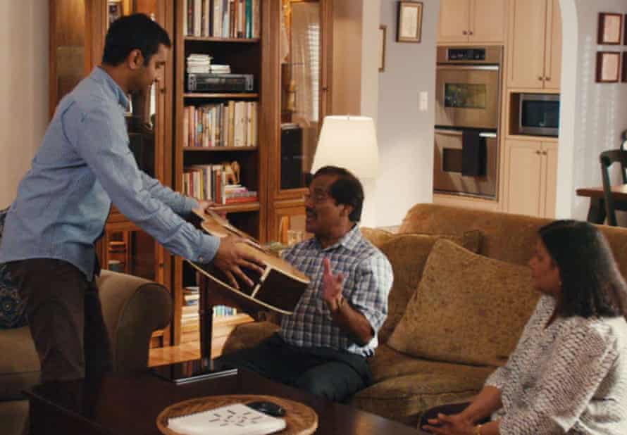 Ansari as Dev in a scene from Master of None, with his parents, played by his real-life parents Shoukath and Fatima Ansari.
