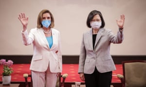 The US House speaker, Nancy Pelosi, left, poses for photographs with Taiwan's president, Tsai Ing-wen, in Taipei on Wednesday 3 August 2022. Photograph: Handout/Getty Images