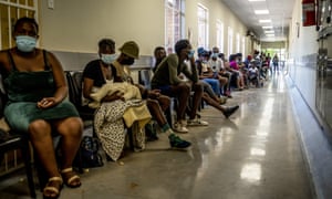 Covid news live: New York state detects five cases of Omicron variant as new US air travel rules loom | World news 3 People queue to be vaccinated against Covid-19 at the Lenasia South Hospital, near Johannesburg on 1 December as the Omicron variant spreads across the country.