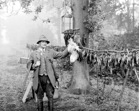 A country gamekeeper, dressed in breeches and leather gaiters with his gibbet.