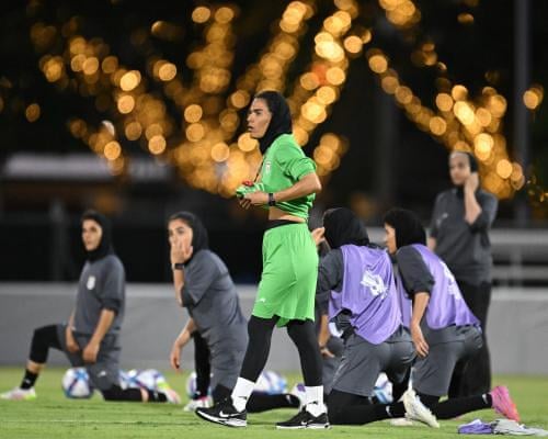 Iran players warm up during a training session at Pizzy Park on the Gold Coast