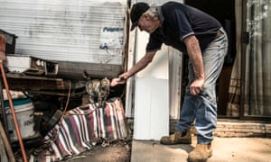 Bill Goddard welcomes Cat home with a slice of devon after fire swept through his Hillview property.