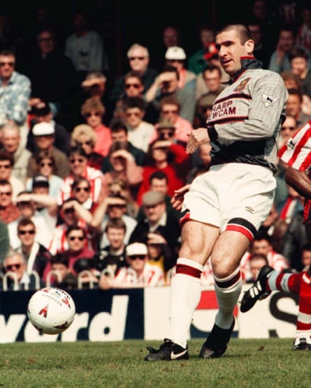 Eric Cantona wears a mashup of Manchester United kits during a miserable first half at Southampton in 1996. United wore their third blue and white kit in the second half.